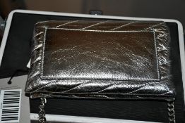 A Tory Burch Kira Chevron Metallic Pave logo chain