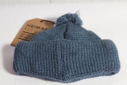 A Heimat Mechanics bobble trail blue one size hat.