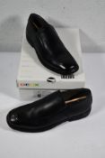 A pair of Geox J Federico slip on shoes (UK 8).