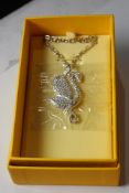 A Swarovski Iconic Swan Necklace Pend: long pendan