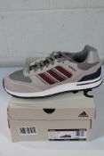 A pair of Adidas Run 80s in grey/burgundy (Size UK