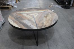 A large round Kleo reclaimed boat wood coffee table with black frame (120cm x 46cm).