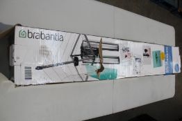A Brabantia Wallfix Dryer 24 M with Storage Box (Viewing recommended).