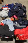 Four boxes full of assorted pre-owned clothing to include Adidas, Champion, Fila and Levis.