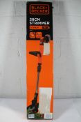 A Black + Decker 28cm Strimmer STC1820PCB (No battery).