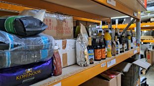 A shelf of assorted food and confectionery items.