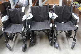 Three unused wheelchairs.