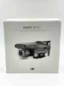 A pre-owned DJI Mavic 2 Pro Drone (Boxed with accessories. Battery not charging, sold as seen).