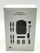 A pre-owned DJ|I Mavic Fly More Kit (Batteries not charging, sold as seen).