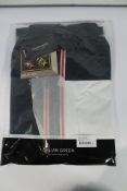 An as new Galvin Green AXL Paclite Gore-Tex Waterproof Golf Jacket G1207 - White/Navy/Orange (XL).