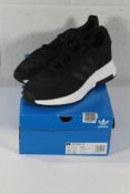 An as new pair of Adidas Retropy F2 Trainers in Black/White, Size UK 11.5 (Box Damaged).