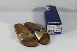 A pair of as new Birkenstock Madrid BS Sandals in Gold, Size UK 6 (Box Damaged).