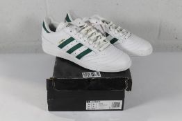 An as new pair of Adidas Busenitz Trainers in White/Green, Size UK 7 (Box Damaged).