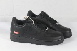 A pair of as new Supreme Nike Air Force 1 Trainers in Black, Size UK 8 (No Box).