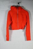 An as new Lululemon Scuba Full-Zip Cropped Hoodie in Solar Orange, Size 4.