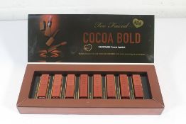 An as new Too Faced Cocoa Bold EM-Power Lipstick 8-Pack to include Chocolate Strawberry, Buttercream