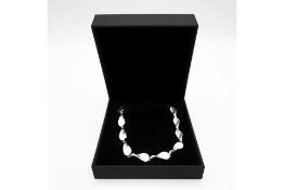 Silver Twisted Petal Accent Bracelet