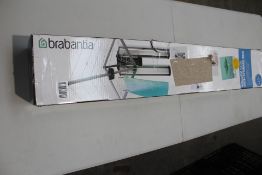A Brabantia Wallfix Dryer 24 M with Storage Box (Viewing recommended).