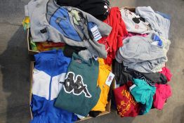 Four boxes full of pre-owned clothing and related to include Adidas, Champion and Kappa.