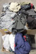 Five boxes full of assorted pre-owned clothing to include Reebok, Fila and New Balance.