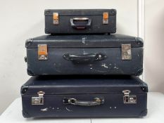Three vintage Globetrotter vulcanised fibre suitcases in navy blue.