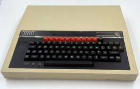 A pre-owned Acorn BBC Microcomputer with PSU, manuals & three cassettes (Untested, sold as seen).