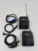 Two pre-owned Sennheiser SK 100 G4 Bodypack Transmitters, a clip-on mic and cables in a storage pouc