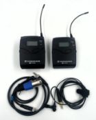 Two pre-owned Sennheiser SK 100 G3 Bodypack Transmitters, a clip-on mic and cables in a storage pouc