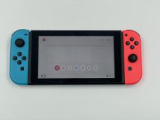 A pre-owned Nintendo Switch Console (HAC-001-01) 32GB with Neon Blue/Red Joy-Con Controllers (No cha
