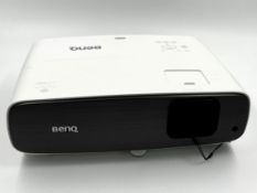 A pre-owned BenQ W2700 4K Home Cinema DLP Projector (Tested, working - fan noise loud, possible loos