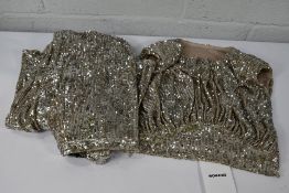 A pair of Womance sequined fit and flare side zip nude trousers and matching sleeveless crop top (Si