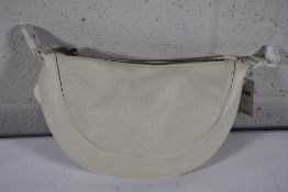 An as new Urban Originals Super Mini Luna Bag in Ivory.