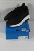 An as new pair of Adidas Retropy F2 Trainers in Black/White, Size UK 11.5 (Box Damaged).