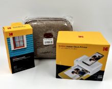 A boxed as new Kodak PD460 Instant Dock Printer Dock, 80-Sheet Paper Cartridge and Accessory Bundle.