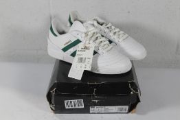 A pair of Adidas Busenitz Trainers in White/Green, Size UK 7 (Box Damaged).