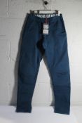 A pair of Looking For Wild Fitz Roy Climbing Pants in Blue Wing Teal, Size M.
