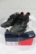 A pair of Reebok Legacy Lifter III Sneakers - Black/White (UK 9, box damaged).