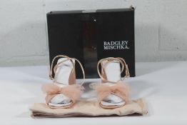 A pair of women's Mischka Tess Tulle bow block heel sandal in blush (Size 9) (Bottom of sole very sl