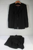 A women's pre-owned Giorgio Armani Suit - Black (48, via The RealReal).