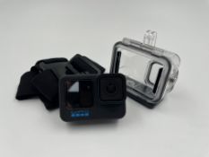 A pre-owned GoPro HERO10 Black Camera with battery & accessories in carry case.