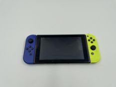 A pre-owned Nintendo Switch Console (HAC-001) with Joy-Con Controllers (No charger, game cards or ot