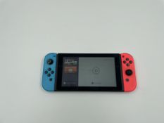 A pre-owned Nintendo Switch Console (HAC-001) with Joy-Con Controllers (Missing rear stand. No charg