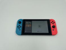 A pre-owned Nintendo Switch Console (HAC-001-01) with Joy-Con controllers, 8 x game cards and case (