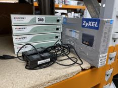 Three pre-owned FortiGate 60D, a Fortiwifi 60D and an as new Zyxel Wireless N300 VDSL2 4-port Gatewa