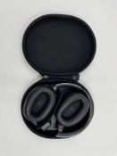 A pre-owned pair of Sony WH-1000XM2 Wireless Noise Cancelling Headphones with case.