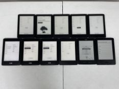 Eleven pre-owned Amazon Kindle E-Readers (Assorted models and conditions).