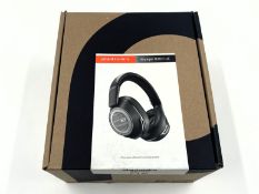 An as new Plantronics Voyager 8200 UC Bluetooth Headset (P/N: 208769-01).