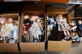 Four Boxes of Assorted Porcelain Dolls, Various Outfits. Pre-owned