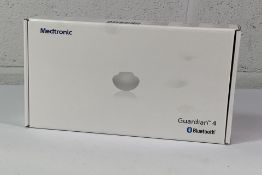 A Medtronic Guardian 4 Transmitter Kit, REF MMT-7840W1. As New and Sealed.