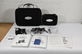 A Pair of Orascoptic 3.5x Magnifying Loupes, Tempo, with a LED Headlight. Possibly Pre-owned.